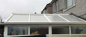 The cleaned conservatory, the white uPVC looks as it should.