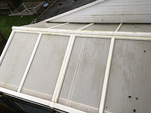 A green and dirty conservatory roof